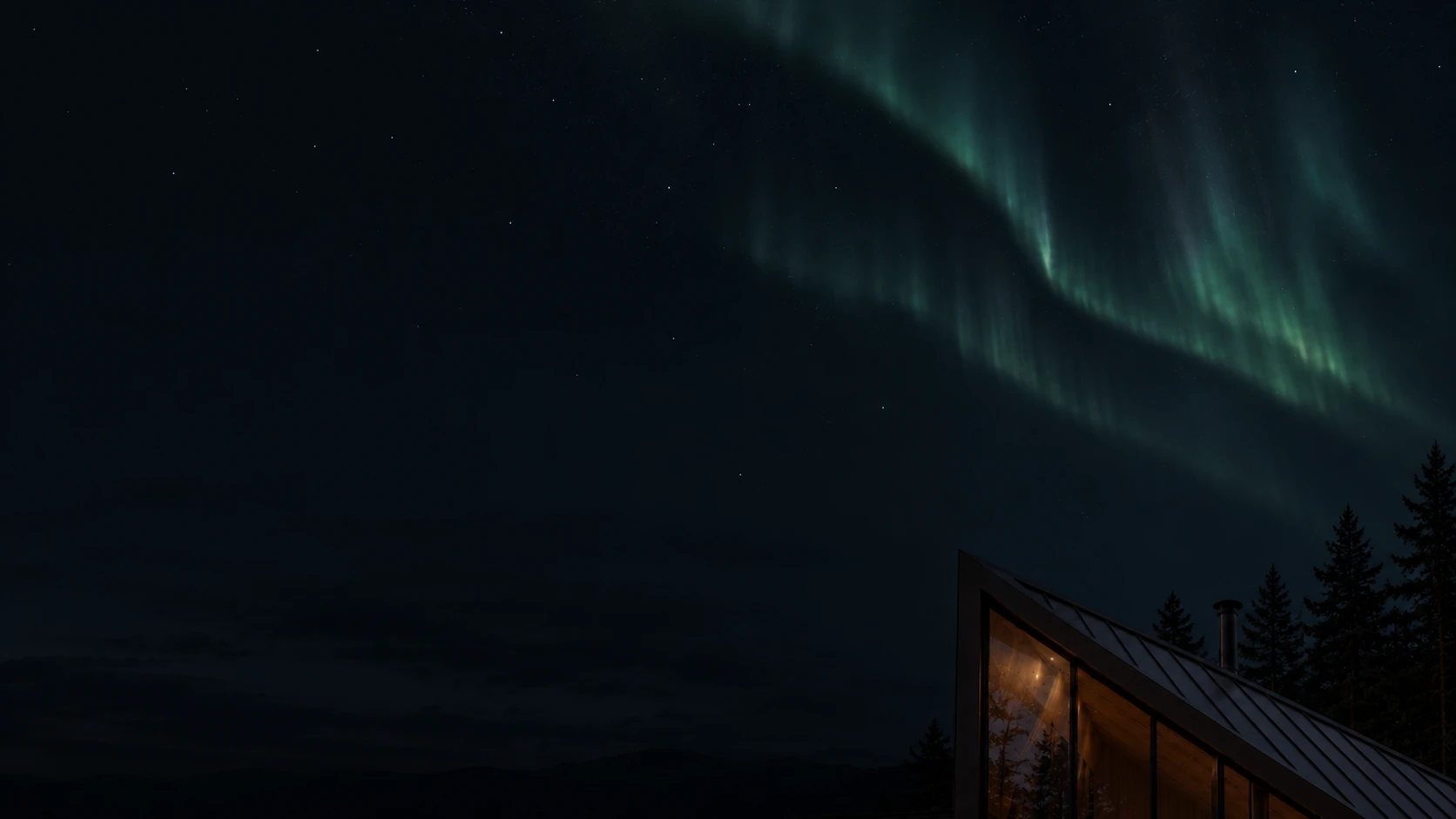 10-night-aurora The house under an aurora at night, the light still on.